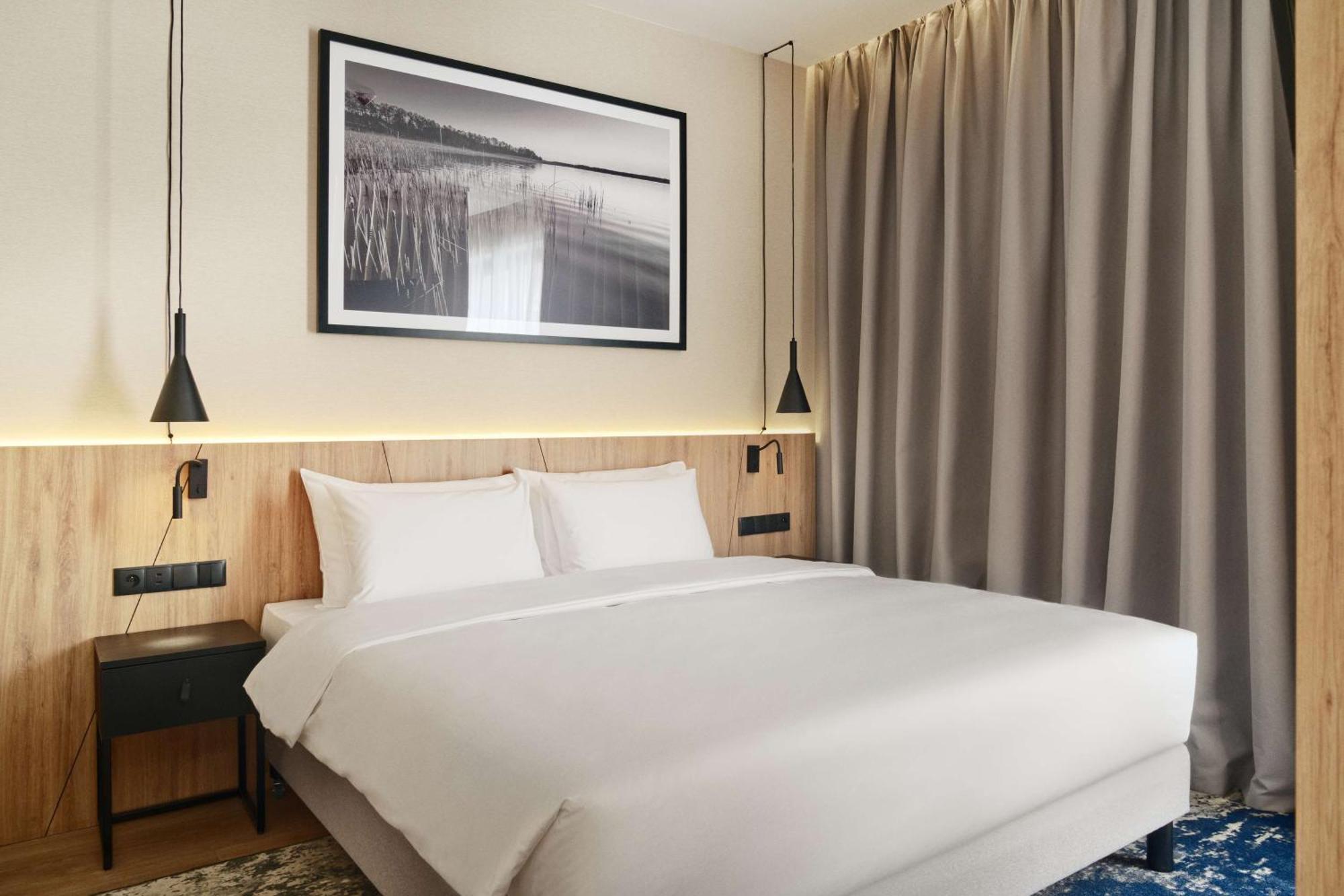 Radisson Blu Resort & Conference Center, Ostroda Mazury Kültér fotó A bedroom at the hotel